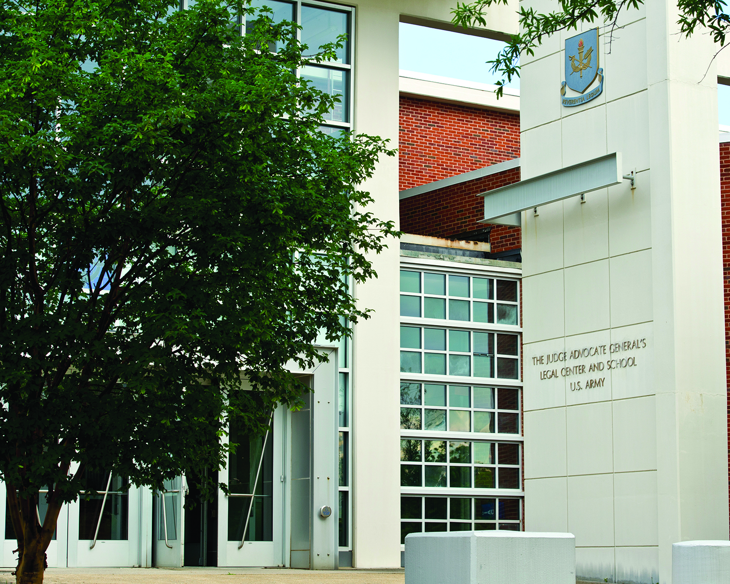 The Decker Auditorium entrance to The Judge
        Advocate General’s Legal Center and School in
        Charlottesville, Virginia. (Credit: Jason Wilkerson/
        TJAGLCS)